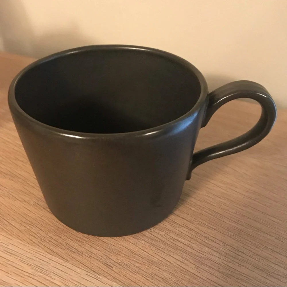 Black Anthropologie iridescent ceramic tea cup